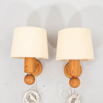 Uno & Östen Kristansson, a pair of pine wall lamps  from Luxus 1970s.