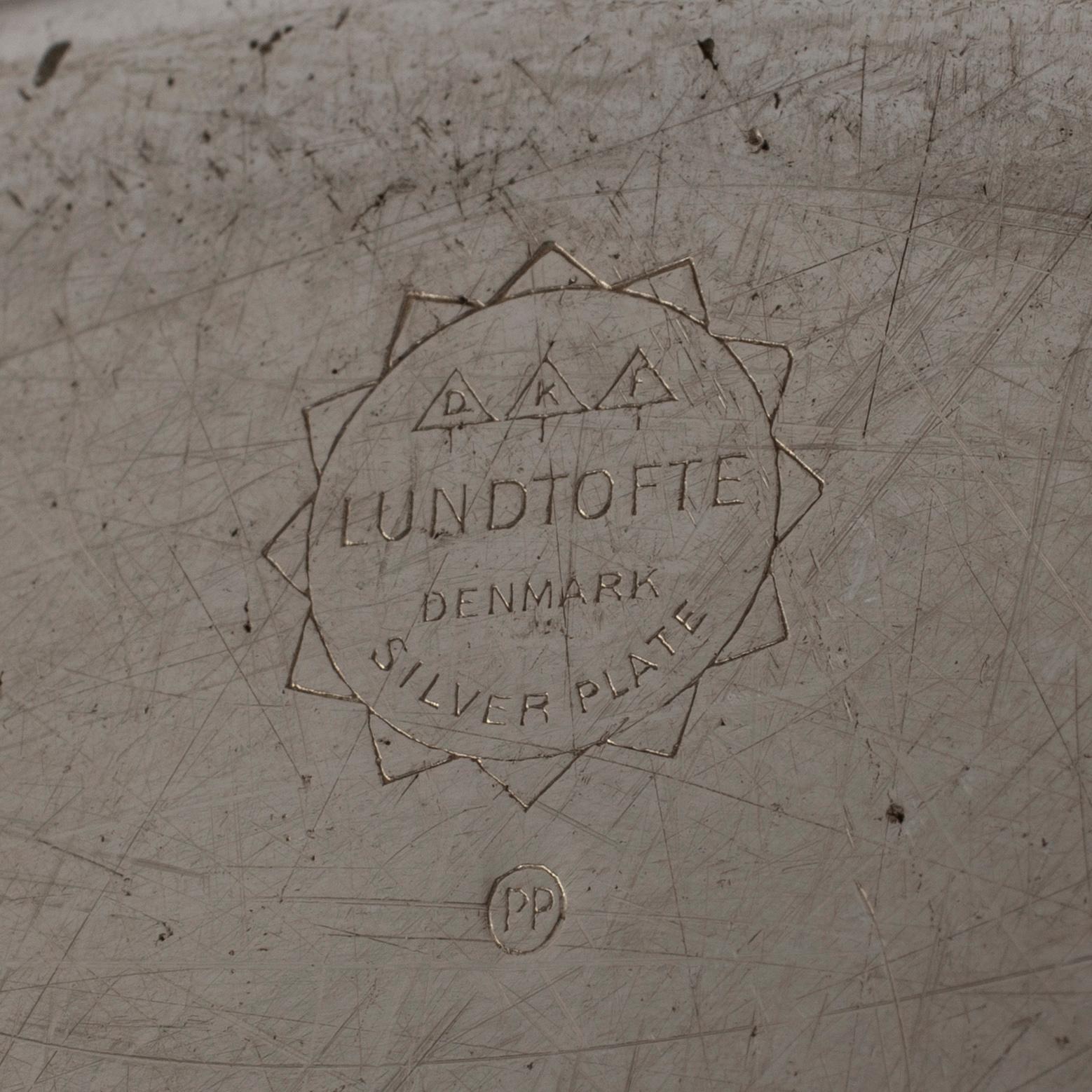 Twelve second half of the 20th Century silver plated plates by Lundtofte, Denmark.