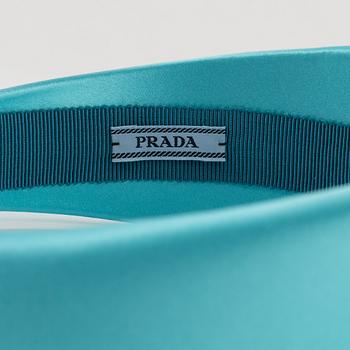 Prada, A turqoise satin headband.