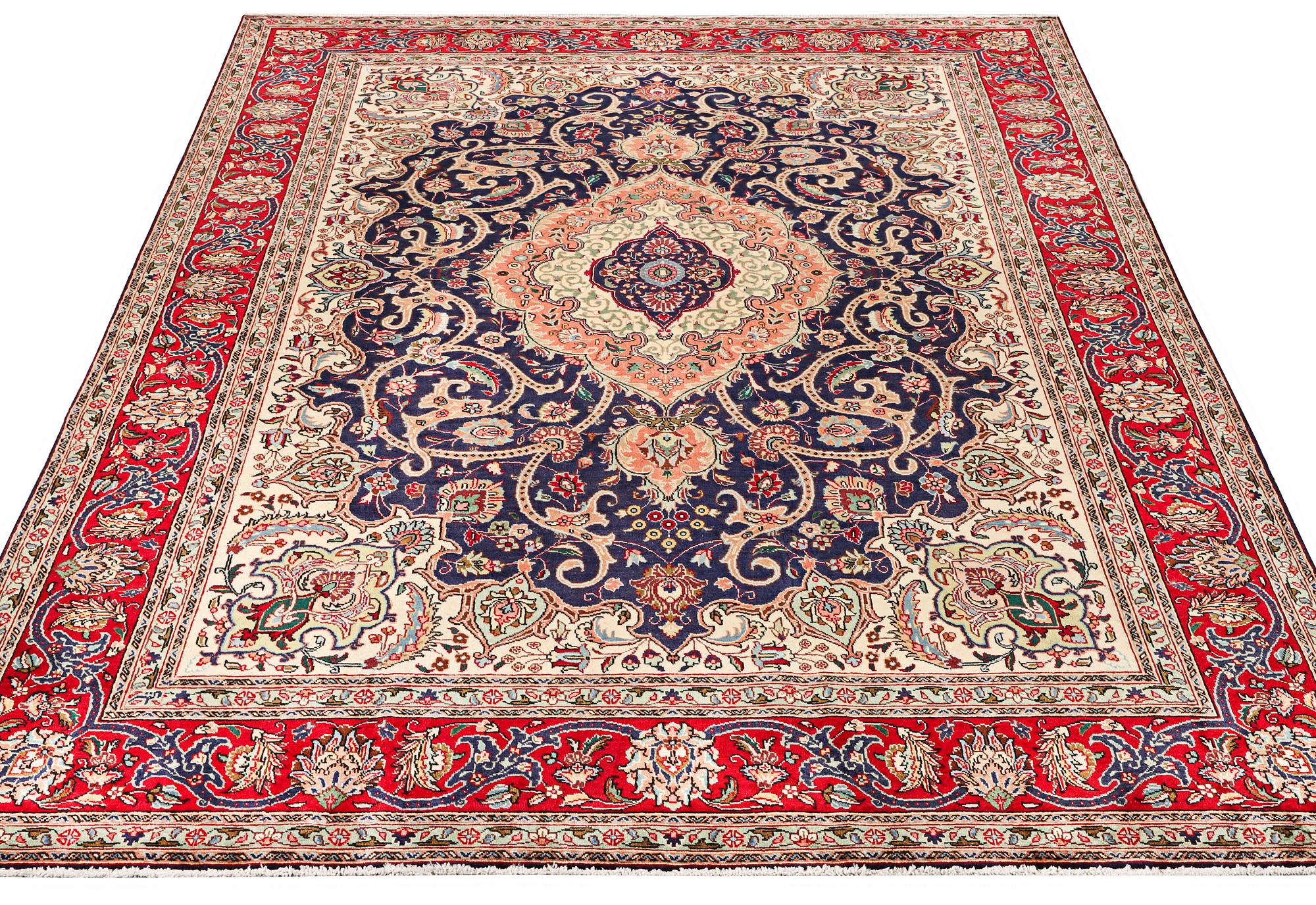 A Tabriz carpet, c. 345 x 255 cm.