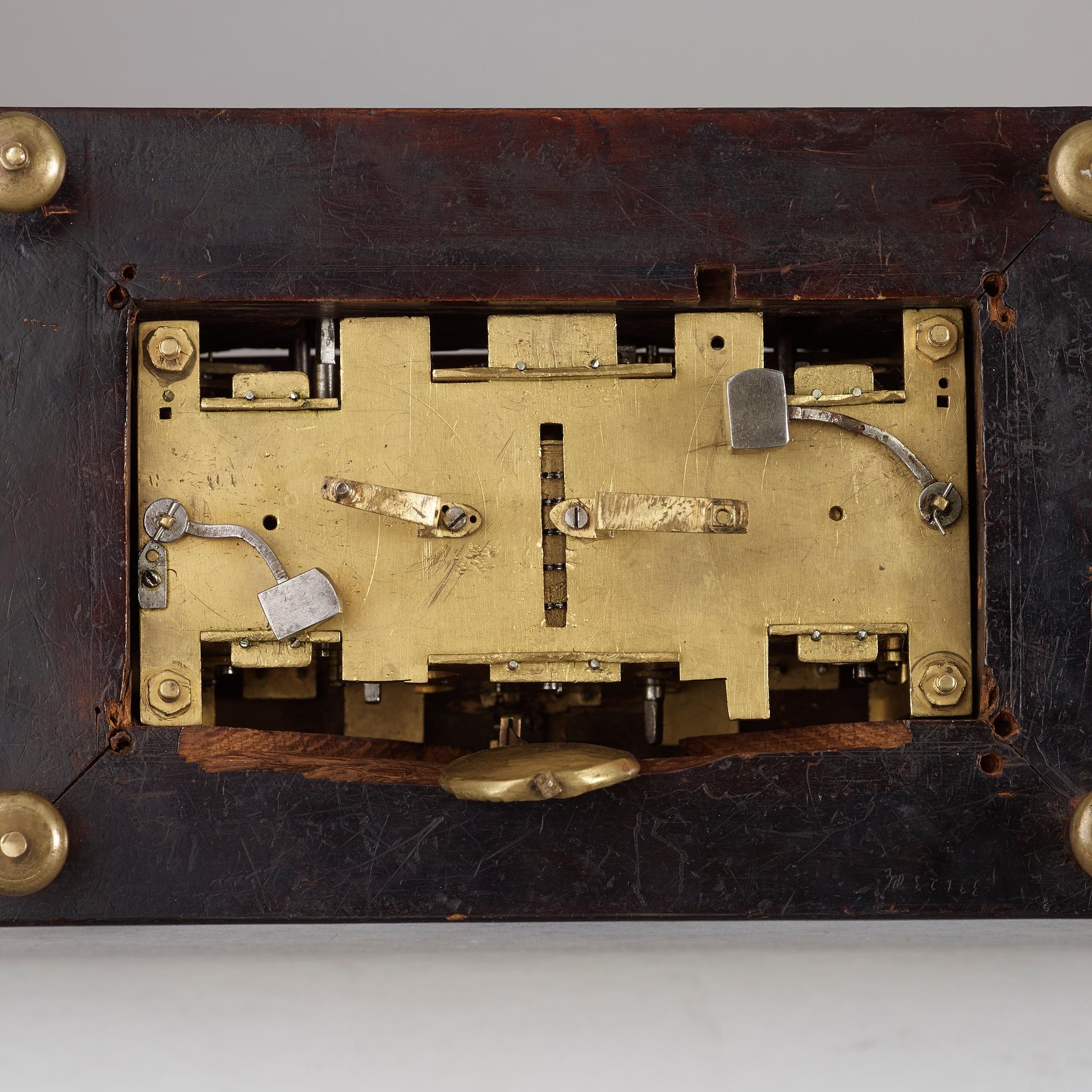 A rare gilt brass on ebonised base Lion Automaton figure clock, Augsburg circa 1630.