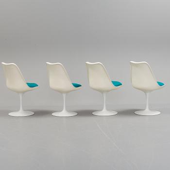 A "Tulip" table and four chairs by Eero Saarinen for Knoll International.