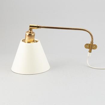 A model 2226 brass wall light by Josef Frank for Firma Svenskt Tenn.