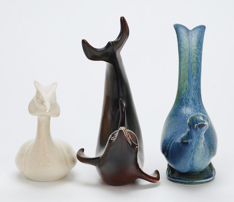 Three Gunnar Nylund stoneware figures, a dolphin, a pheasant and a great crested grebe, Rörstrand.