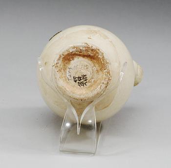 A white glazed ewer, presumably Tang dynasty.