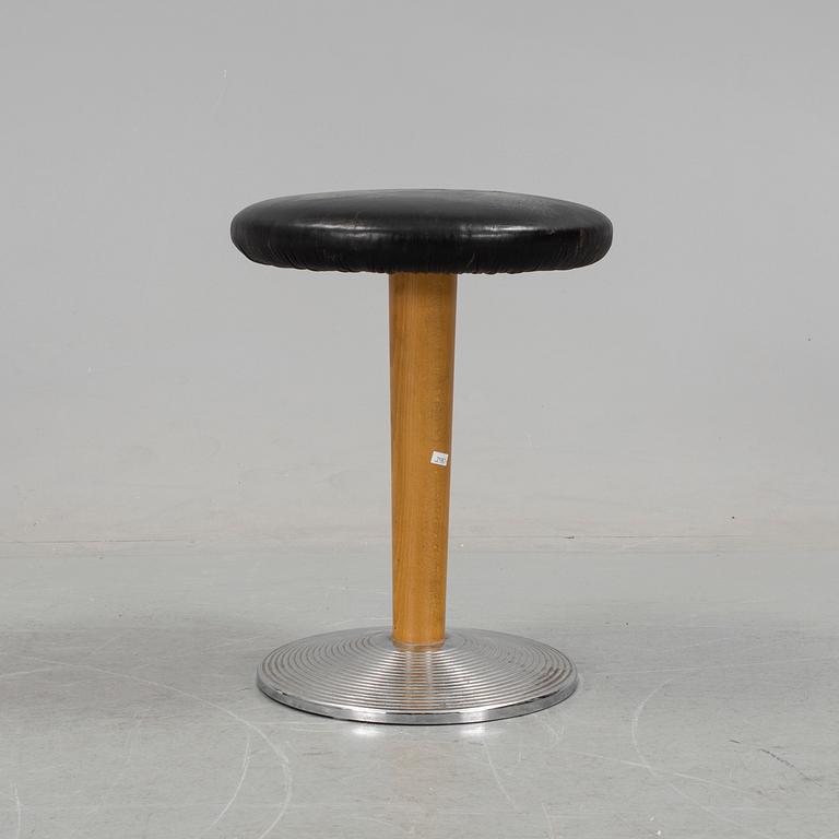 A mid 20th century stool with crome foot and leather coated seat.