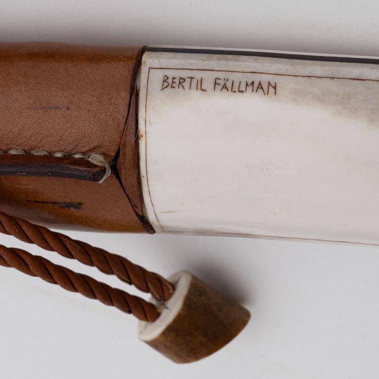 A reindeer horn and skin knife by Bertil Fällman, signed.