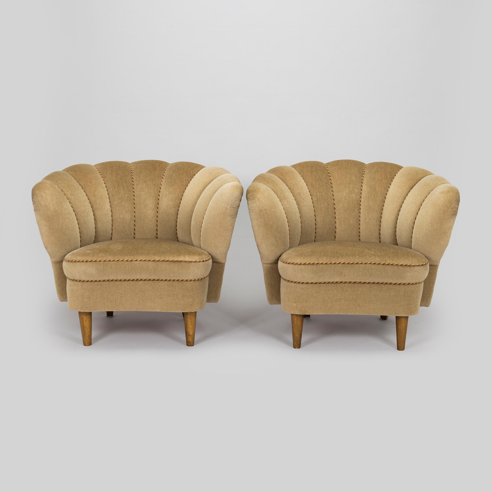 A pair of mid-20th century armchairs.