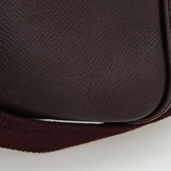 Louis Vuitton, a 'Taiga Kendall PM' weekend bag.