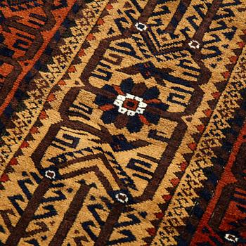 A rug, a semi-antique Baluch, ca 166 x 92 cm.