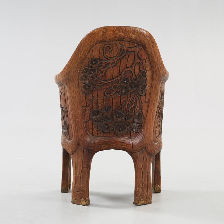 A Gustaf Fjaestad Art Nouveau carved pine chair 'Stabbestol', executed by Adolf Swanson, Arvika, Sweden 1908.