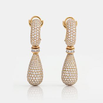 857. A PAIR OF EARRINGS set with princess- and round brilliant-cut diamonds.