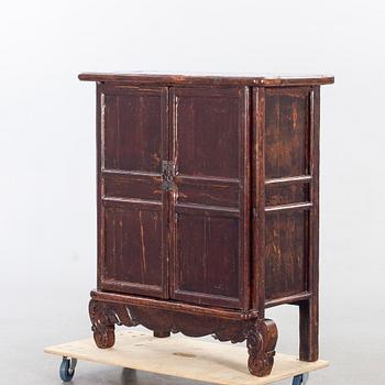 A 19TH CENTURY CHINESE CUPBOARD.