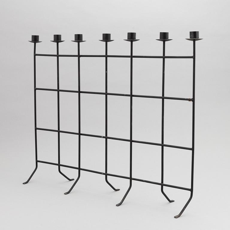 An iron candlestick, second half of the 20th Century.