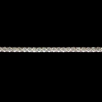 1056. A diamond line bracelet, app. tot. 14 cts.
