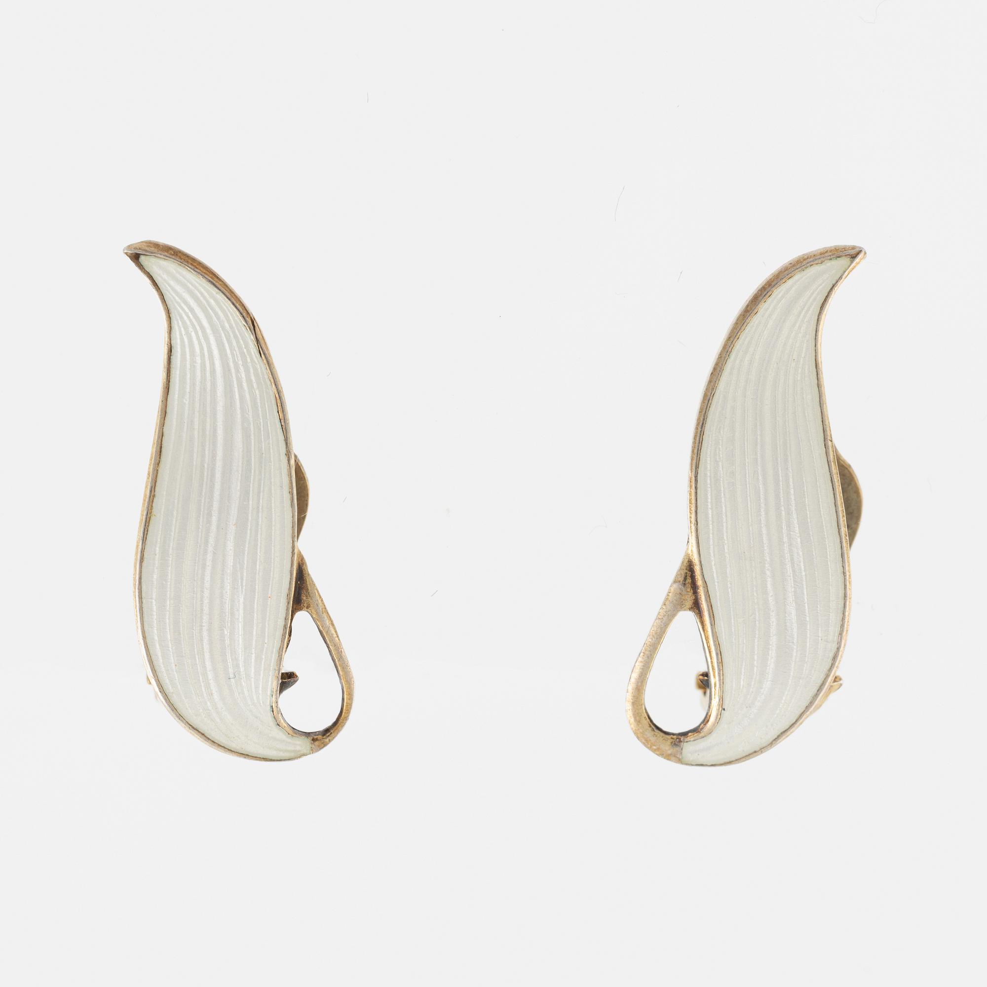 Brooch and a pair of earrings, sterling silver and white enamel. Norway.