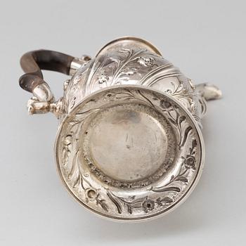 An English 18 th century silver coffee-pot, mark of Benjamin Gignac, London 1763.