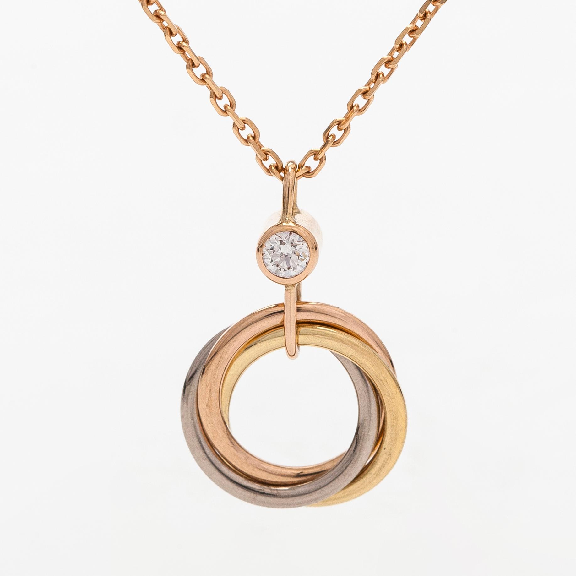 Cartier, halsband, "Trinity Pendant", 18K guld och en briljantslipad diamant.