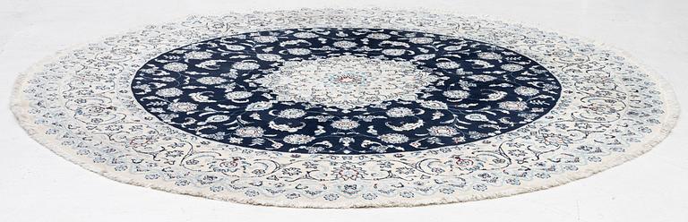 A Nain rug, diameter 243 cm.