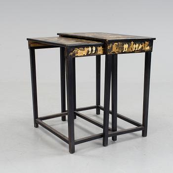 A set of two stacking tables with oriental motif, early 20th century.