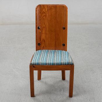 Axel Einar Hjorth, a pair of stained pine "Lovö" chairs, Nordiska Kompaniet, Sweden 1930's.
