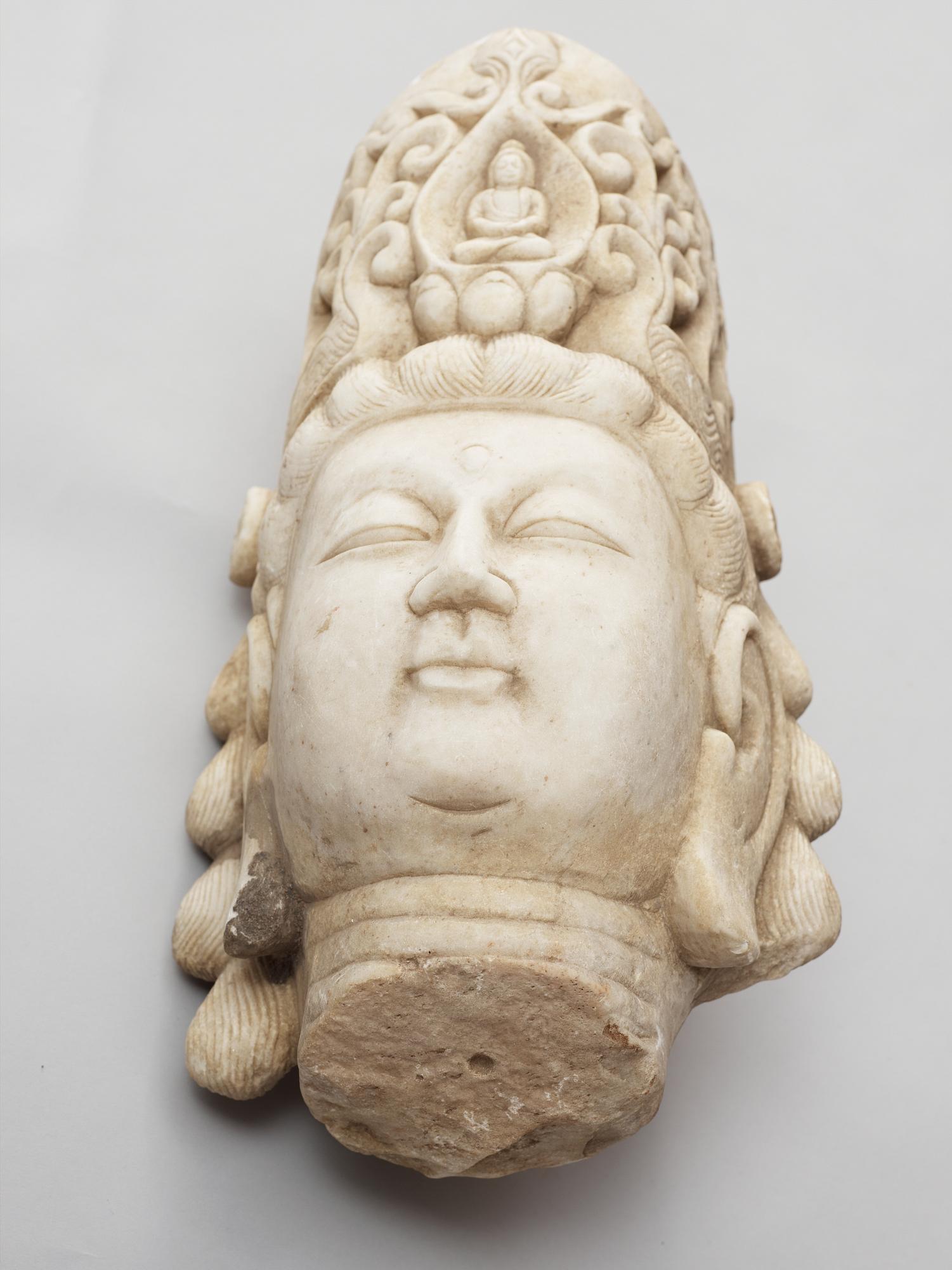 A white stone 20th century buddha head.