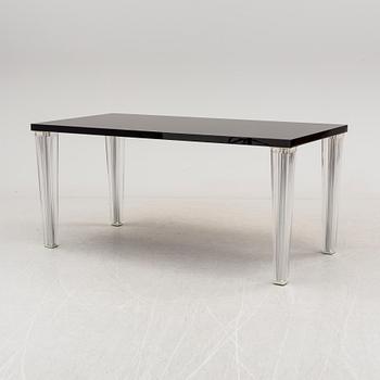 A "Tip Top" dining table by Philippe Starck for Kartell.