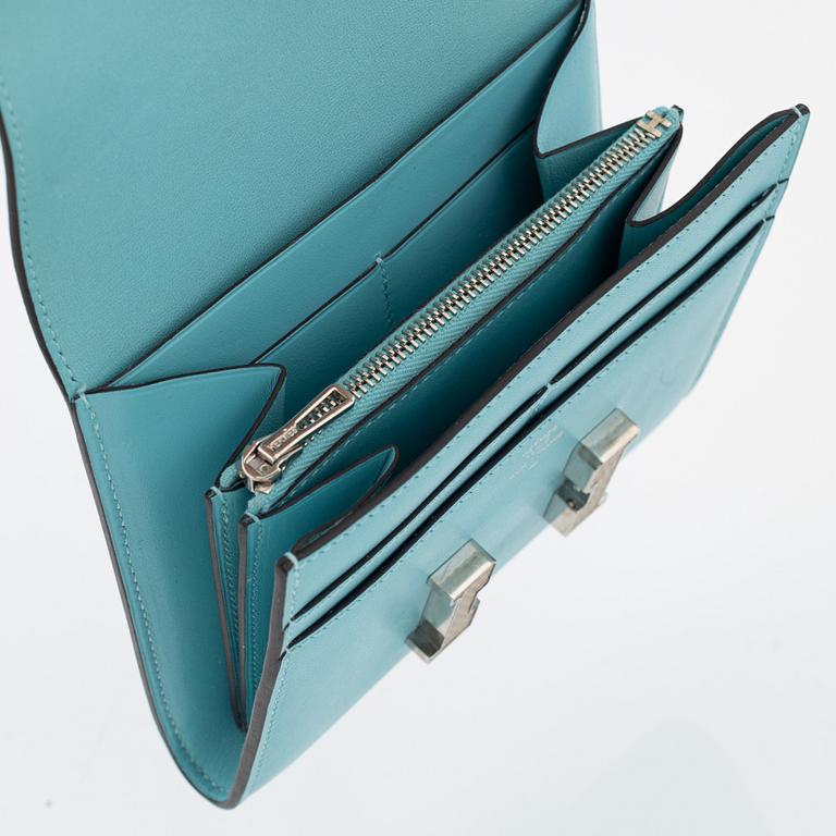 Hermès, a blue leather 'Constance' wallet.