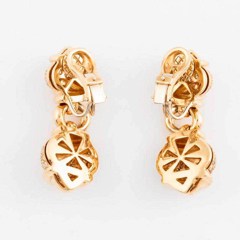 A pair of 18K gold earrings set with round brilliant-cut diamonds.