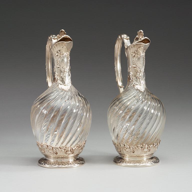 A pair of French late 19th century silver and glass wine-flagons.