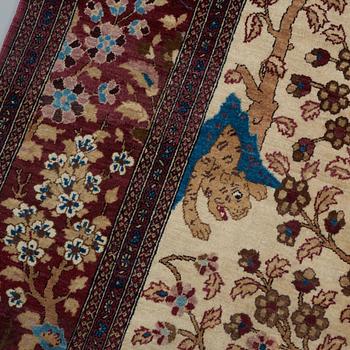 A RUG, a semi-antique Esfahan probably, figural, ca 214,5 x 137,5 cm.