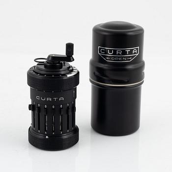 A Curta Type I mechanical calculator.