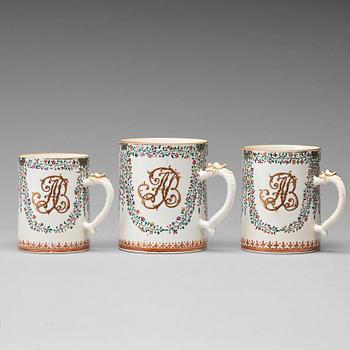 663. A group of three famille rose armorial jugs, Qing dynasty, Qianlong (1736-95).