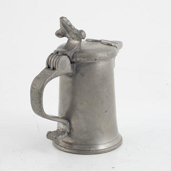 A pewter measuring cup by an unidentified master, dated 1766.