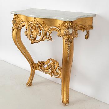 A Rococo revival mirror and a console table, second half of the 20th Century.