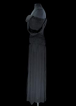 A black silk long dress by Yves Saint Laurent.