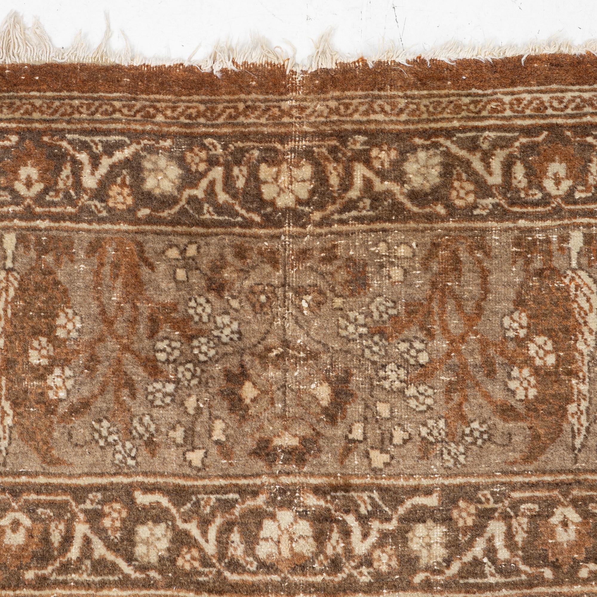 An antique Tabriz carpet, Northwest Persia, 453 x 310 cm.