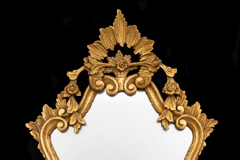 An mid 20th century Louis XV-style mirror from Paoletti, Firenze Italy.