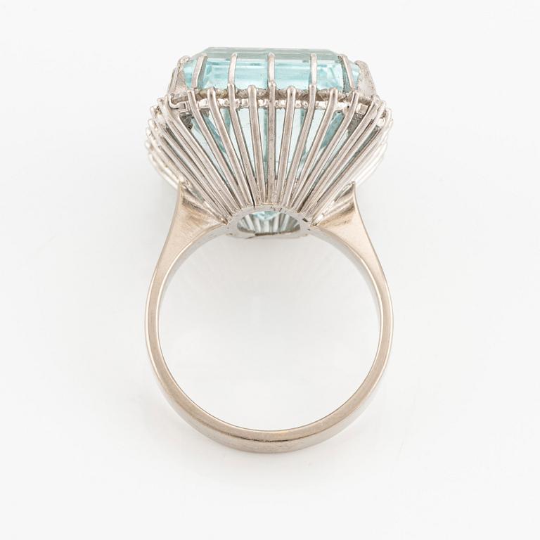 An 18K white gold Engelbert ring set with a aquamarine and round brilliant-cut diamonds.