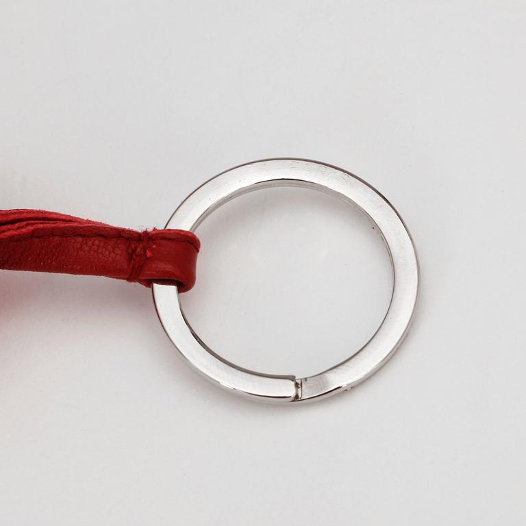 HERMÈS, a key holder in burgundy red leather, "Carmen".