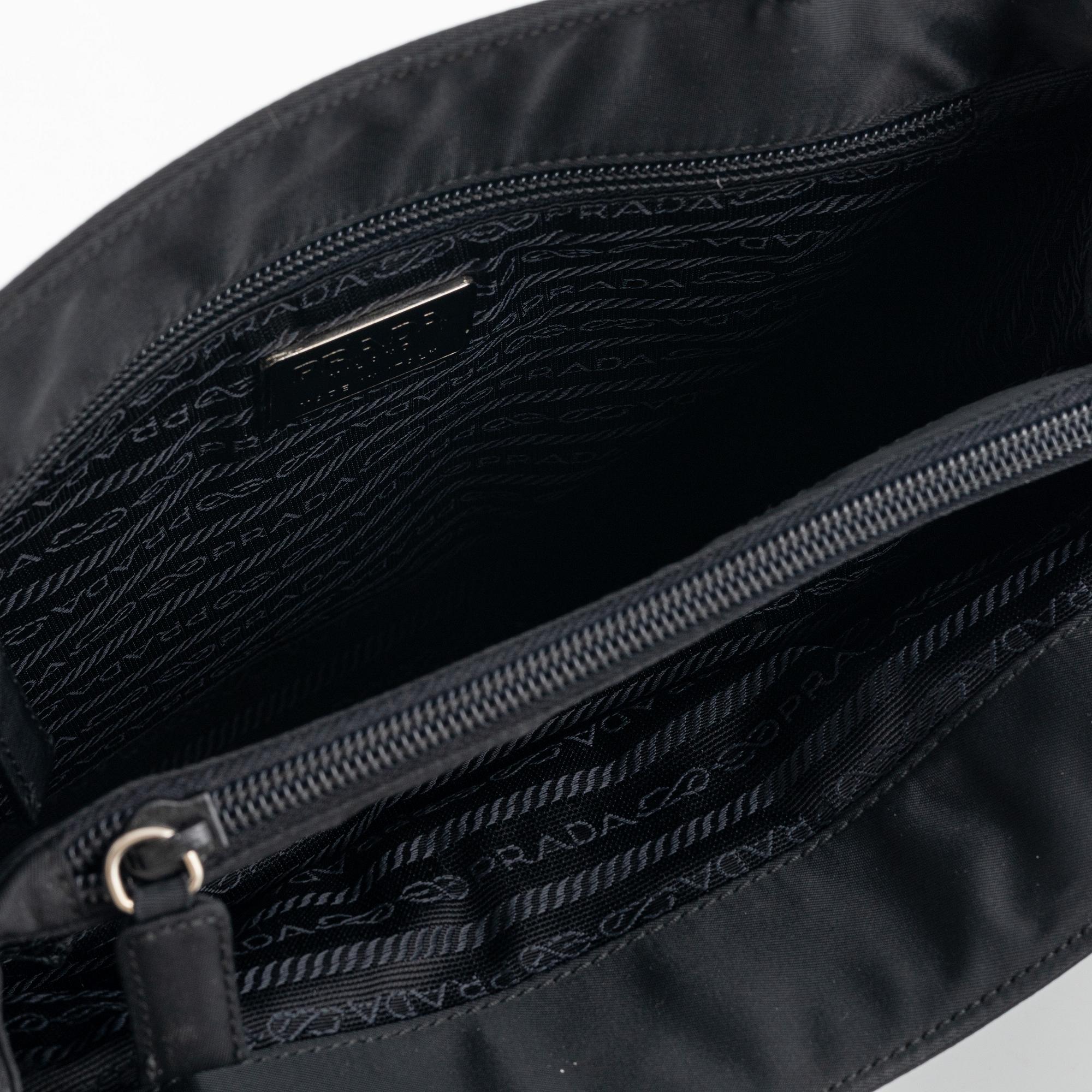 Prada, a black nylon handbag.