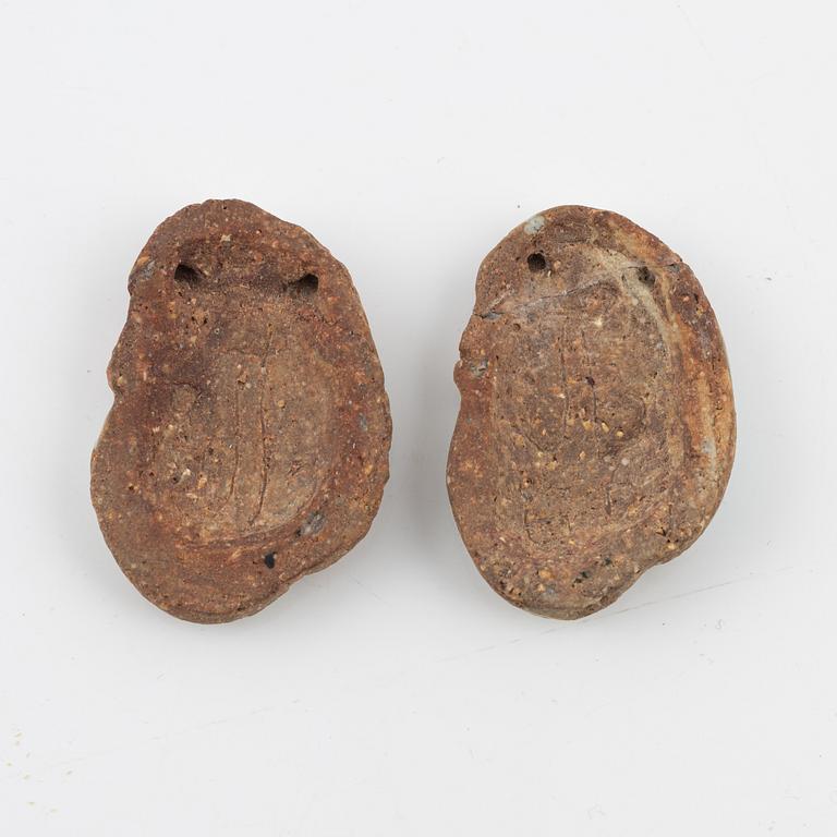 Tyra Lundgren, two stoneware pendants.