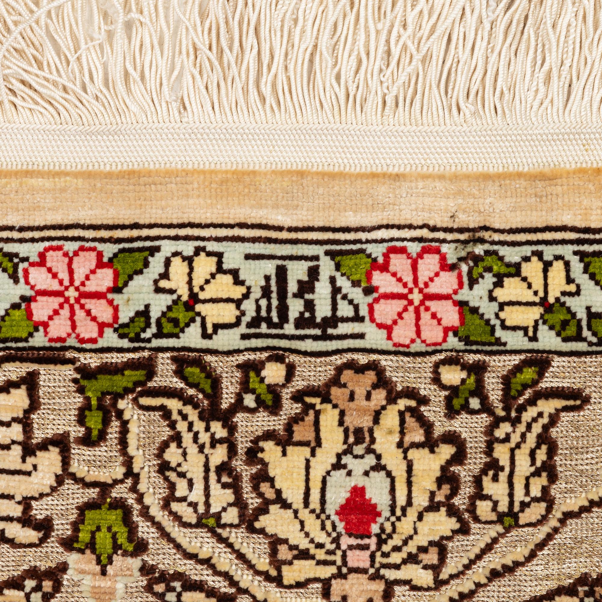 A silk an metal Hereke rug, West Anatolia, c. 100 x 68 cm.