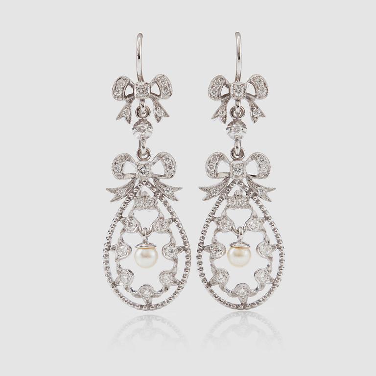 A pair of brilliant-cut diamond earrings. Total carat weight circa 1.00 ct.