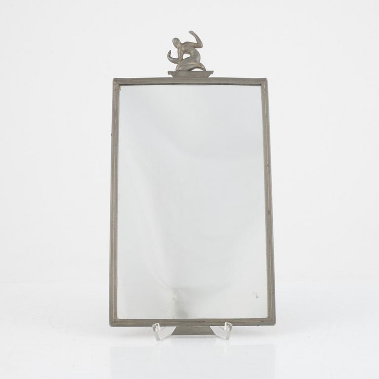 Nils Fougstedt, a pewter mirror, model "A 140", Firma Svenskt Tenn, Stockholm 1928.