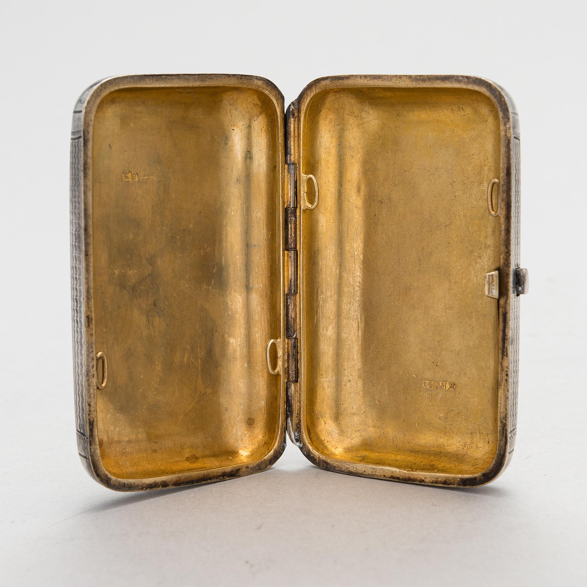 A Russian, parcel-gilt silver cigarette case, maker's mark of Karl Verlin, Saint Petersburg 1871-1878.