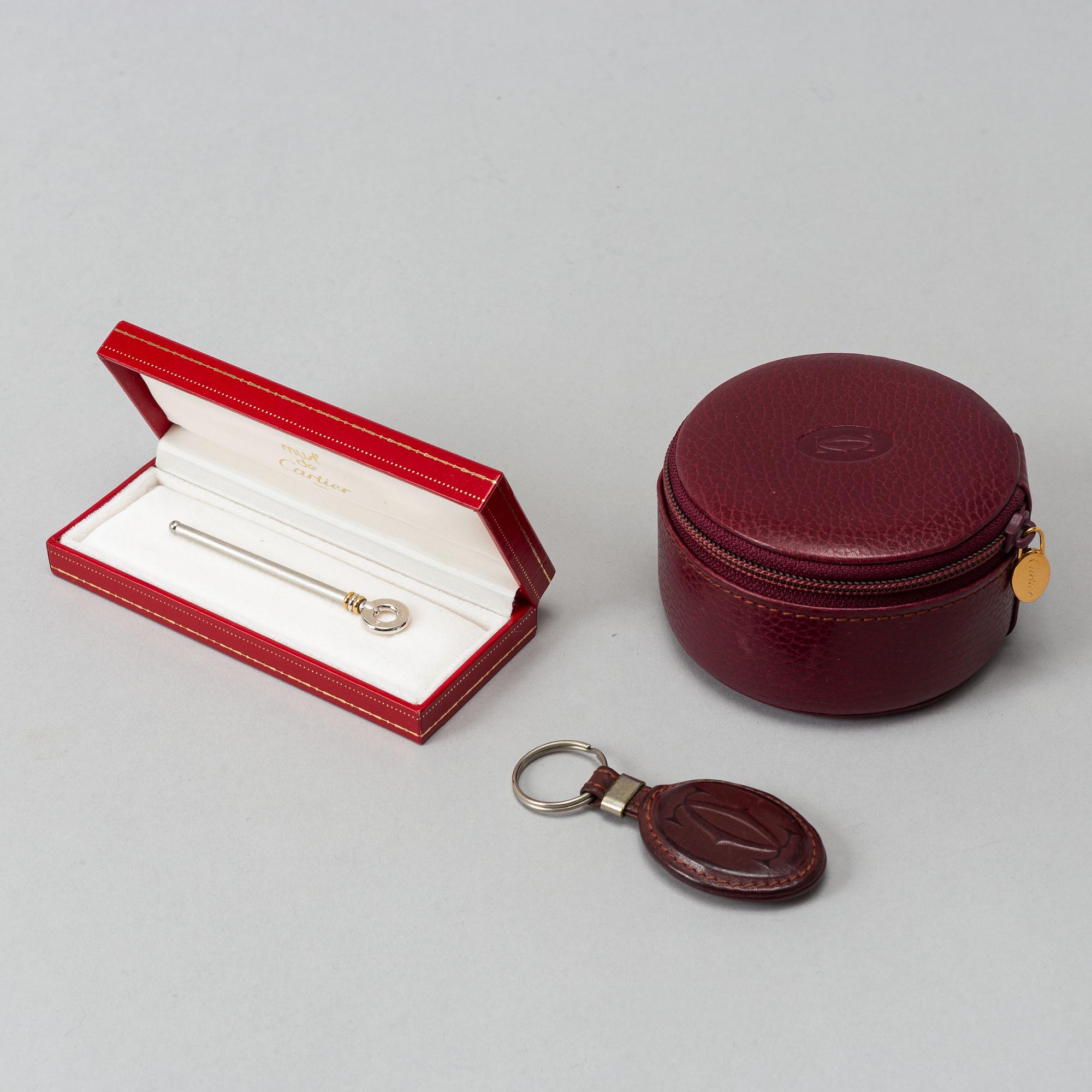 Cartier, jewelery box, key ring and Le must de Cartier champagne swizzle stick.