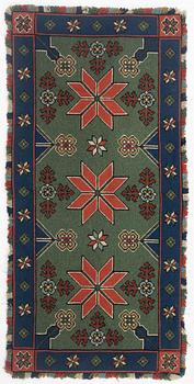 A Scania cross-stitch embroidered cushion, Sweden, around 1900, c. 99 x 47 cm.