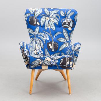 A mid-20th century armchair 'Siesta' manufacturer  Puunveisto Oy - Träsnideri Ab, Finland.