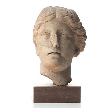 A marble head of a woman, probably Roman 100-200 AD.